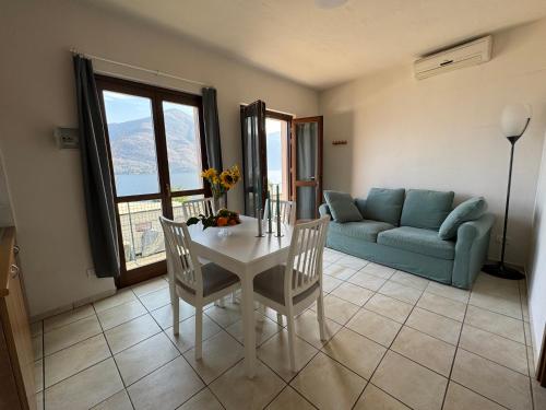a living room with a table and a couch at Lakeview Cannobio Camping & Resort in Cannobio