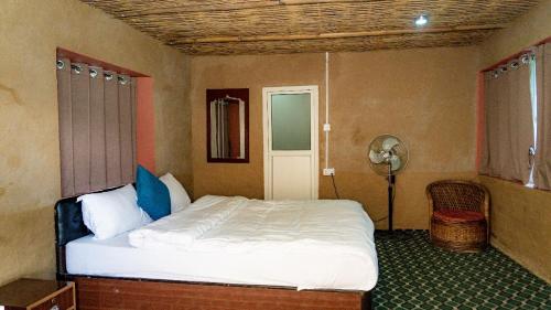 Ένα ή περισσότερα κρεβάτια σε δωμάτιο στο 14 Miles hotel and restaurant