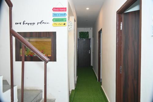 a hallway with a green floor in a building at The Temple View in Varanasi