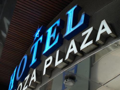 
a neon sign on the side of a building at Hotel Zaragoza Plaza in San Sebastián
