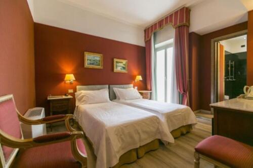 a hotel room with a bed and a window at Best Western Hotel Rivoli in Rome