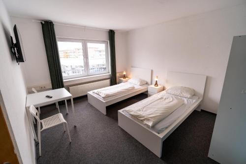 Tempat tidur dalam kamar di ATRIUM - komfortables Apartment HORCHHEIMER