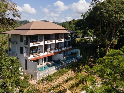 an aerial view of a building with a roof at Kachonghills Tented Resort Trang in Trang