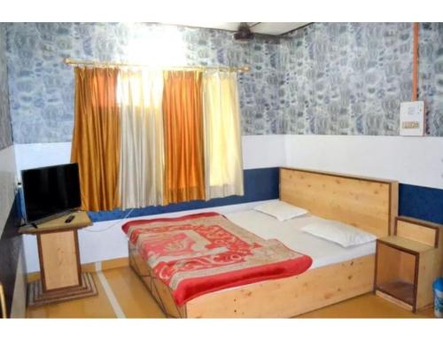 Lova arba lovos apgyvendinimo įstaigoje Hotel Royal, Pachmarhi