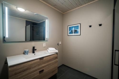 a bathroom with a sink and a mirror at Bjorli Fjellstuer - by Classic Norway Hotels in Bjorli
