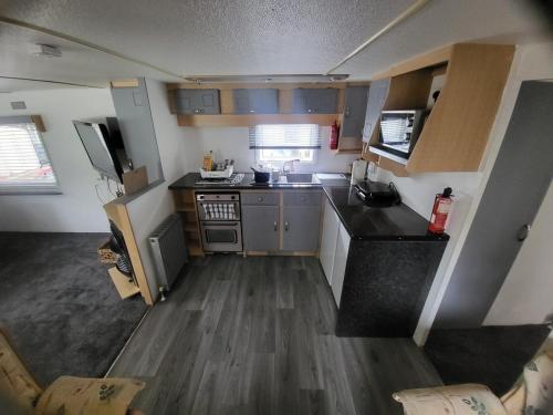 an aerial view of a kitchen in a tiny house at 15 bluebell lane in Hastings