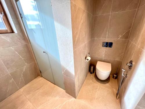 a small bathroom with a toilet and a shower at RAJ zdravia in Bratislava