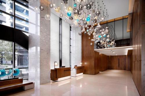 a lobby of a building with a chandelier at Fairfield by Marriott Taichung in Taichung