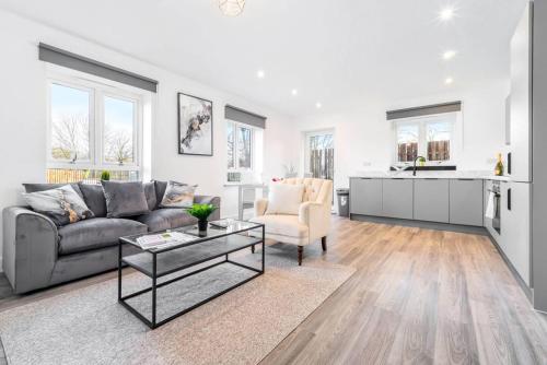 a living room with a couch and a table at The Marsons Collection - 2 Bedrooms Apartment - Balcony - Secure Parking - 1MC in Birmingham