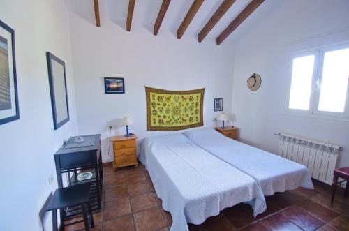 En eller flere senge i et værelse på Cortijo Bellavista