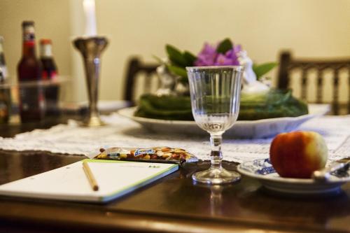 a table with an apple and a glass on it at Romantik Hotel Alte Vogtei in Hamm