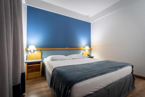 Katil atau katil-katil dalam bilik di Brivali Hotel Centro