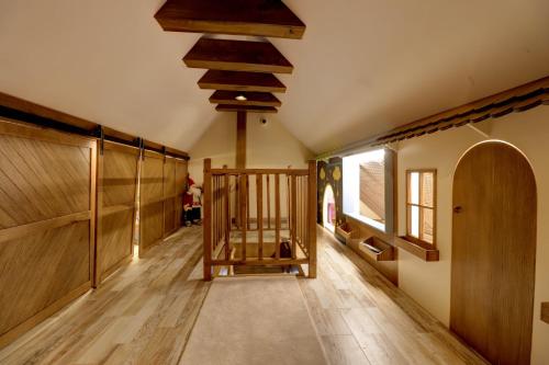 a hallway with wooden floors and a wooden ceiling at Captivating 3-Bed Villa in Brezovica Ski Centre in Brezovica
