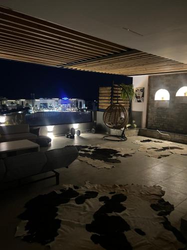 a living room with a couch and a table at Sallam Lux Property in Hurghada
