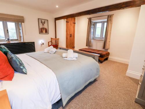 a bedroom with a large white bed in a room at Rockhill Farmhouse in Craven Arms