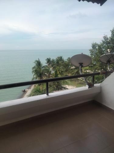 a balcony with a view of the ocean at Seaview beach Corus Paradise pd in Port Dickson