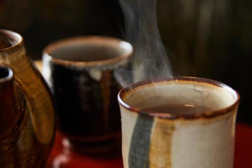 a group of three cups with smoke coming out at Lhotel de Mai in Tamba-sasayama