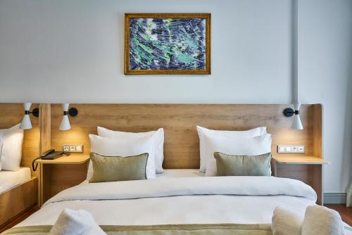 two beds sitting next to each other in a room at Joyway Hotels Istanbul Sultanahmet in Istanbul