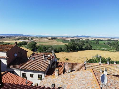 an aerial view of roofs of houses and a field at Camera Torre Panoramic in Montalto di Castro