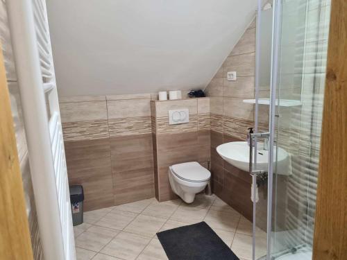 a small bathroom with a toilet and a sink at Turistično - Izletniška kmetija Žerjav in Brežice