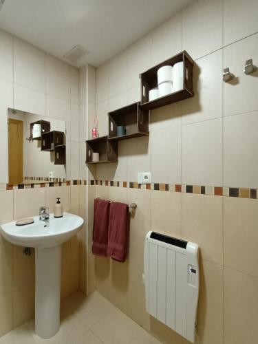 a bathroom with a sink and a toilet and a sink at Casa Majo Valdelinares VUTE-23-002 in Valdelinares