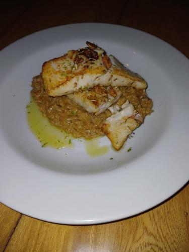 a white plate with a piece of food on it at Cristal Blue Barú in Baru