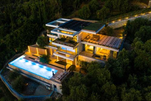 an aerial view of a house with a pool at Amberton Green Villas Corfu in Corfu Town
