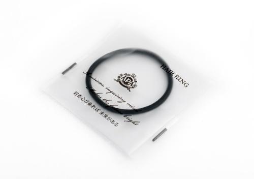 a black ring on top of a white envelope at APA Hotel Osaka Temma in Osaka