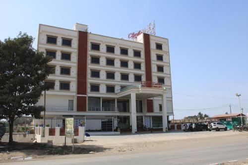 a building on the side of a street at Clarks Collection Somnath in Somnath