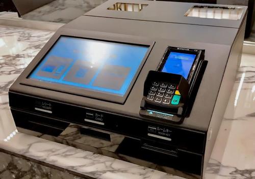 an electronic device with a cell phone and a tablet at APA Hotel Osaka Temma in Osaka