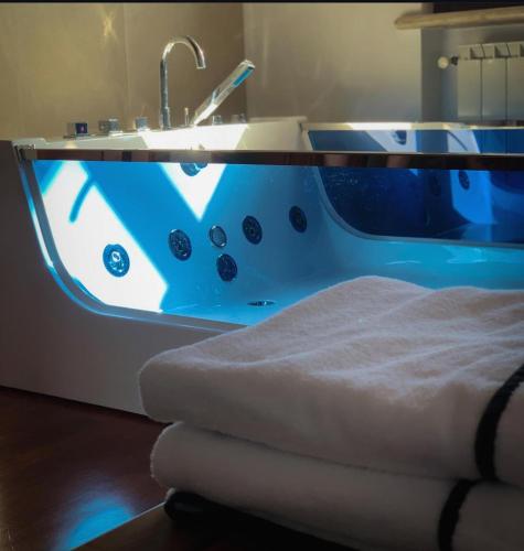 a blue and white bath tub with a sink at Bed and Breakfast Villa Romano in Anzio