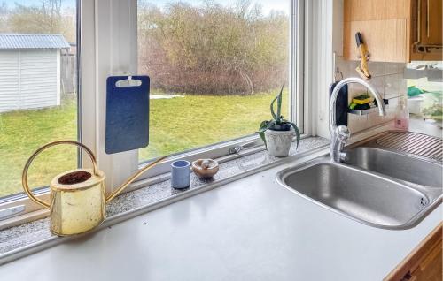 a kitchen counter with a sink and a window at Lovely Home In Slite With Wifi in Slite