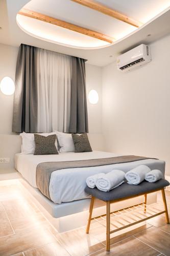 Letto o letti in una camera di City Center Suites