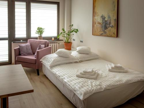 En eller flere senge i et værelse på Apartament Iga