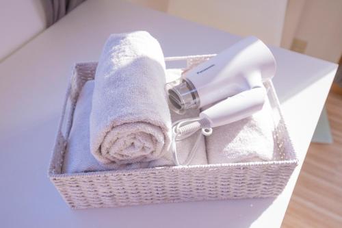 a basket with a hair dryer and a hairdryer at The most comfortable and best choice for accommodation in Yoyogi SoSI in Tokyo