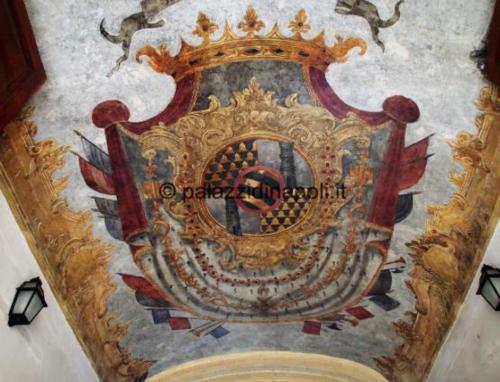 a painting of a crown on a wall at Deluxe Spaccanapoli in Naples