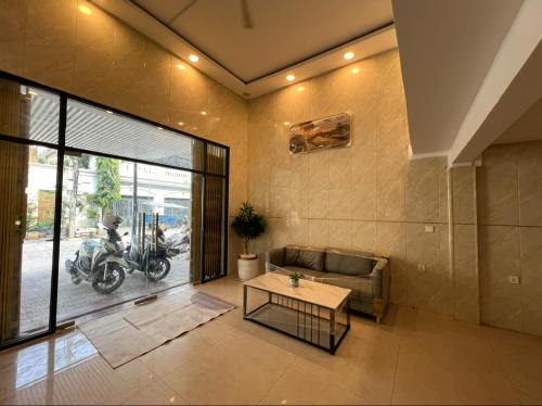 a living room with a couch and a table at White House Guesthouse in Phnom Penh