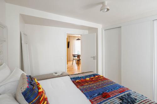 Postel nebo postele na pokoji v ubytování Story Studio Coimbra Centro - Culture