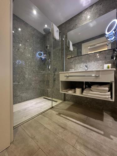 a bathroom with a sink and a shower at Michelangelo Boutique Hotel Dalyan in Dalyan