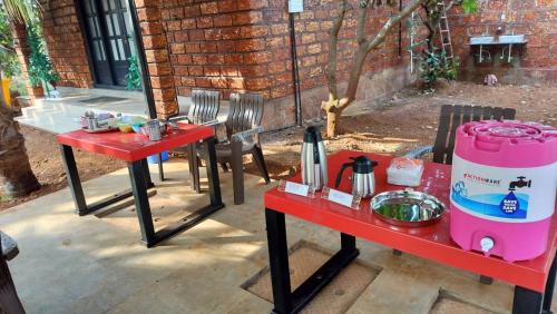 a couple of tables with a grill on them at Saka kadams home stay in Guhagar