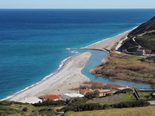 an aerial view of a beach next to the ocean at La Nature in Konístrai