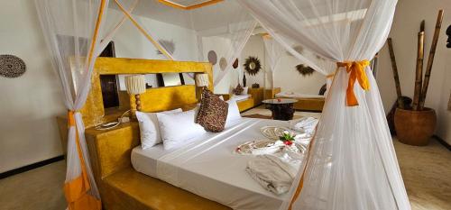 Postel nebo postele na pokoji v ubytování Milele Beach Resort