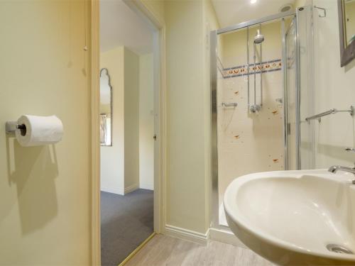 a bathroom with a sink and a shower at 3 Bed in Thornham KT111 in Thornham