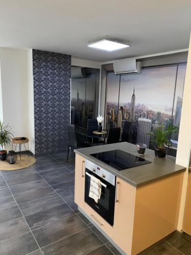 an office with a kitchen with a view of the city at Highrise Horizon Penthouse in Budapest