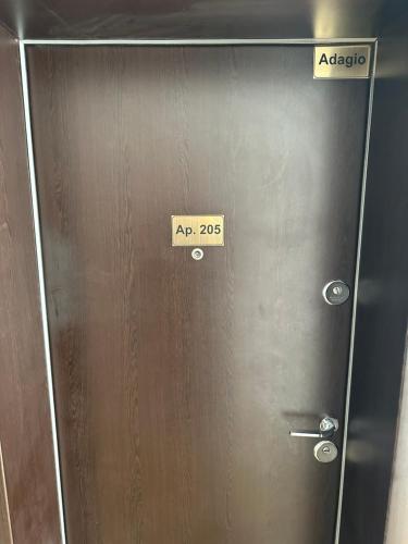 a metal door with a sign that says acrobat on it at Adagio apartment in Creţuleasca