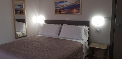 Postel nebo postele na pokoji v ubytování Hotel Margherita Meublè