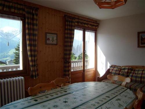 a room with a table with two dogs on it at Chalet Crest-Voland, 6 pièces, 8 personnes - FR-1-733-2 in Crest-Voland