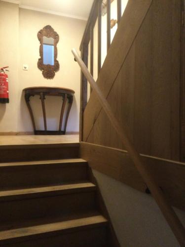 a set of stairs with a mirror on the wall at Maison Druyard huis met 5 slaapkamers in Durbuy
