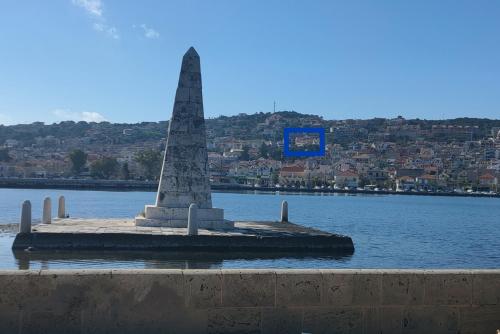 a monument in the middle of a body of water at Blue Lagoon Luxury Apartment A3 in Argostoli