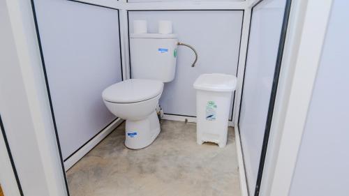 a small bathroom with a toilet in a stall at Nomad Camp in Erfoud